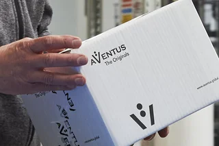 Box of AVENTUS origital parts in the hands of a service technician